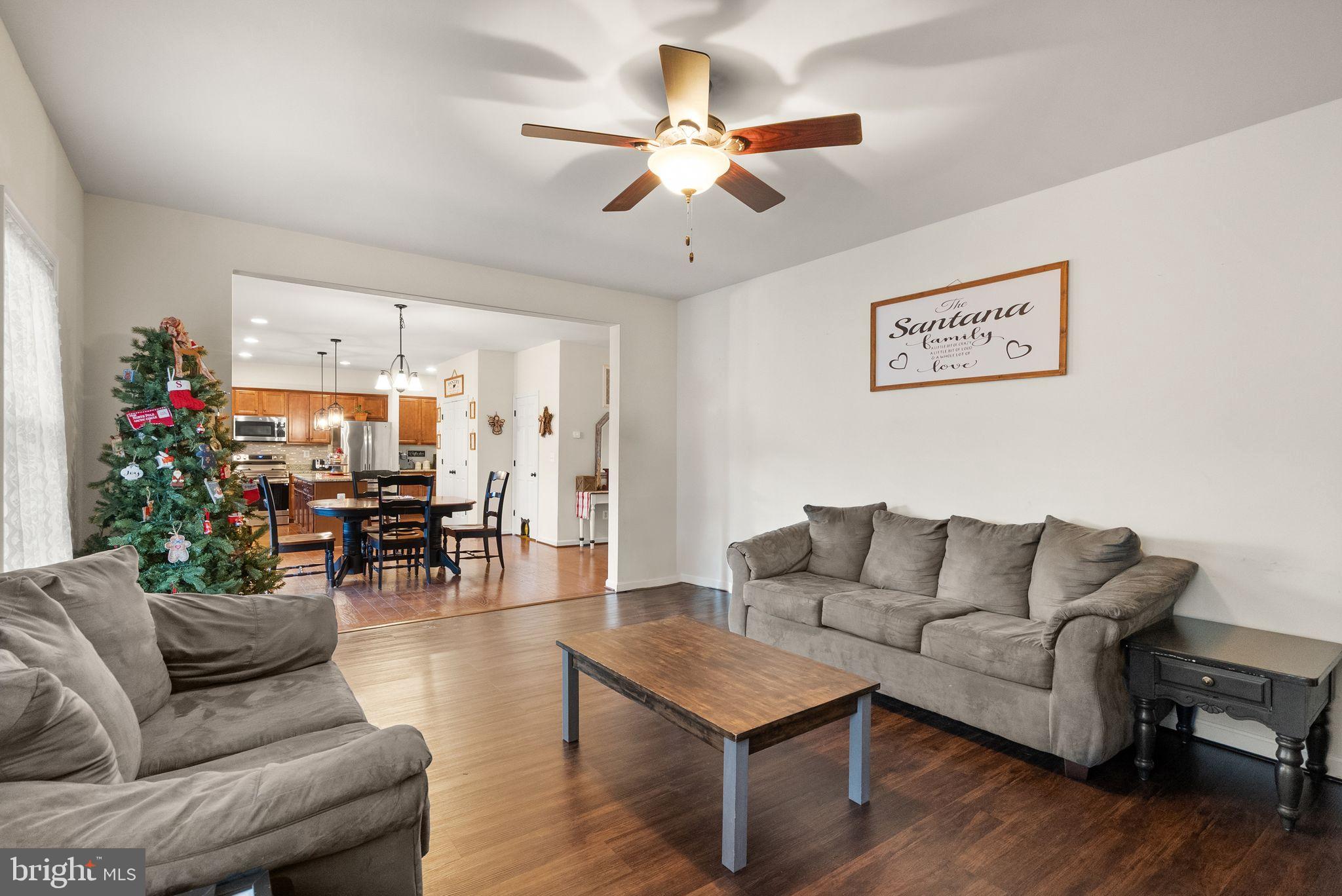 2219 Wildflower Way Locust Grove, VA 22508 - Photo 21 of 49 a living room with furniture and a large window