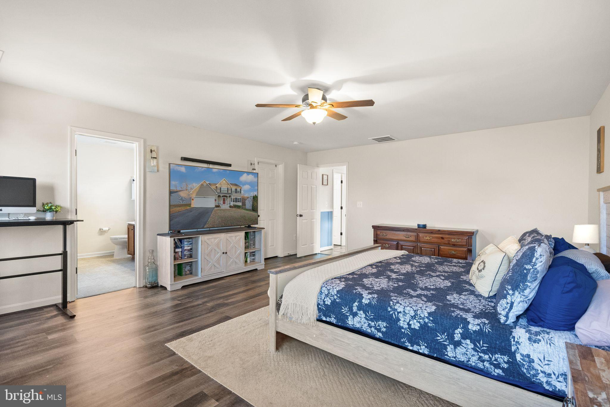 2219 Wildflower Way Locust Grove, VA 22508 - Photo 27 of 49 a living room with furniture and a flat screen tv