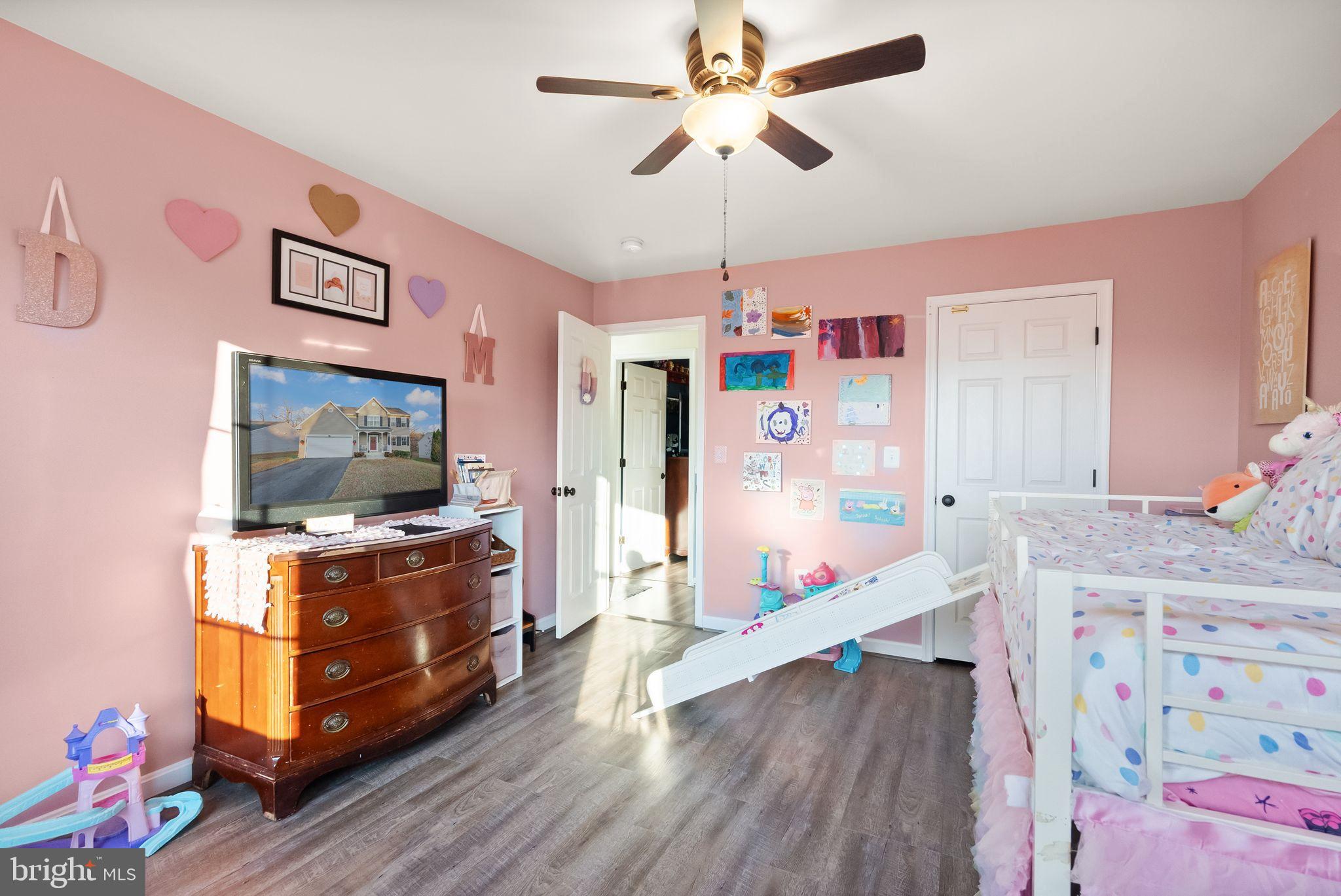 2219 Wildflower Way Locust Grove, VA 22508 - Photo 36 of 49 a living room with furniture and flat screen tv