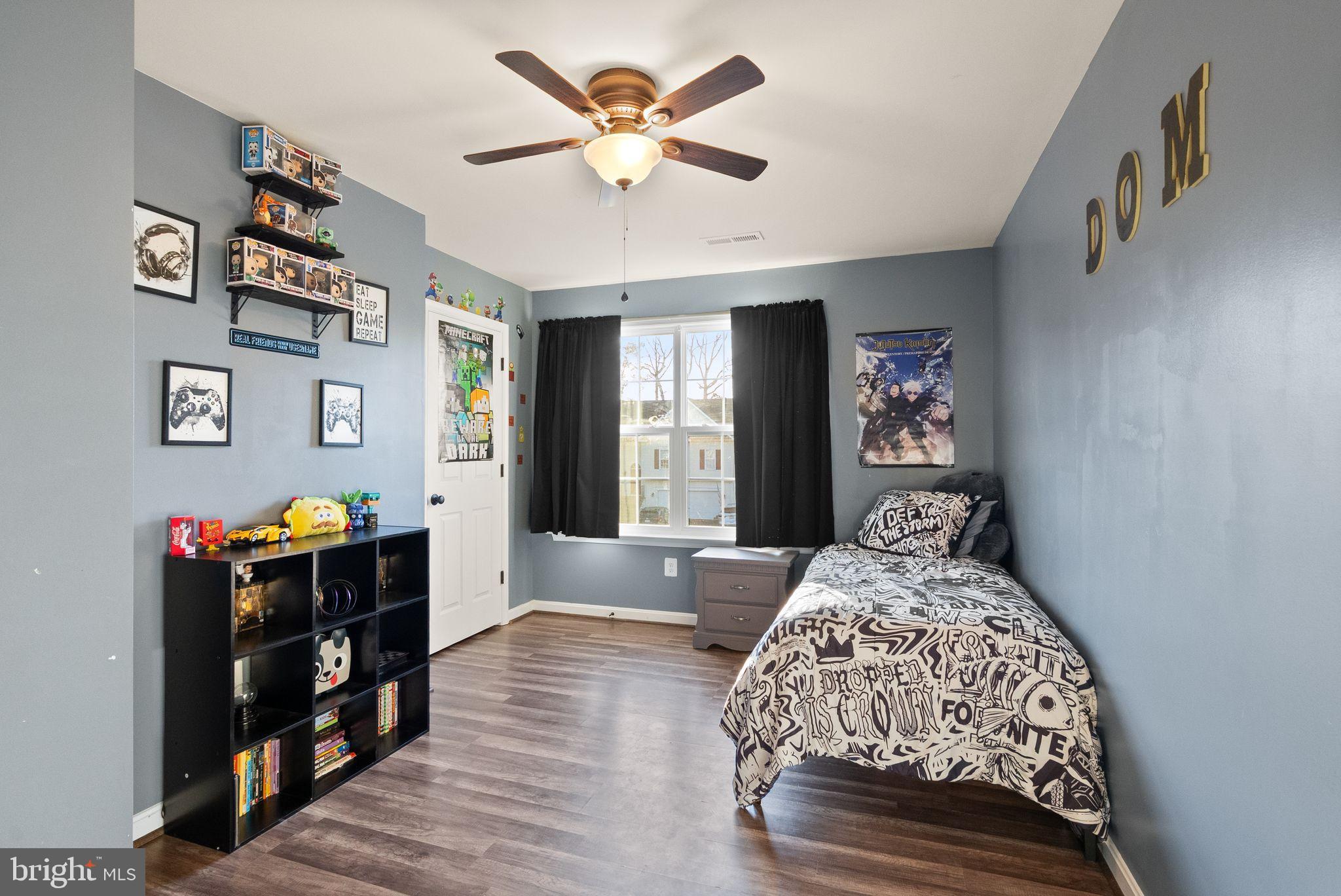 2219 Wildflower Way Locust Grove, VA 22508 - Photo 37 of 49 a bedroom with a bed and wooden floor