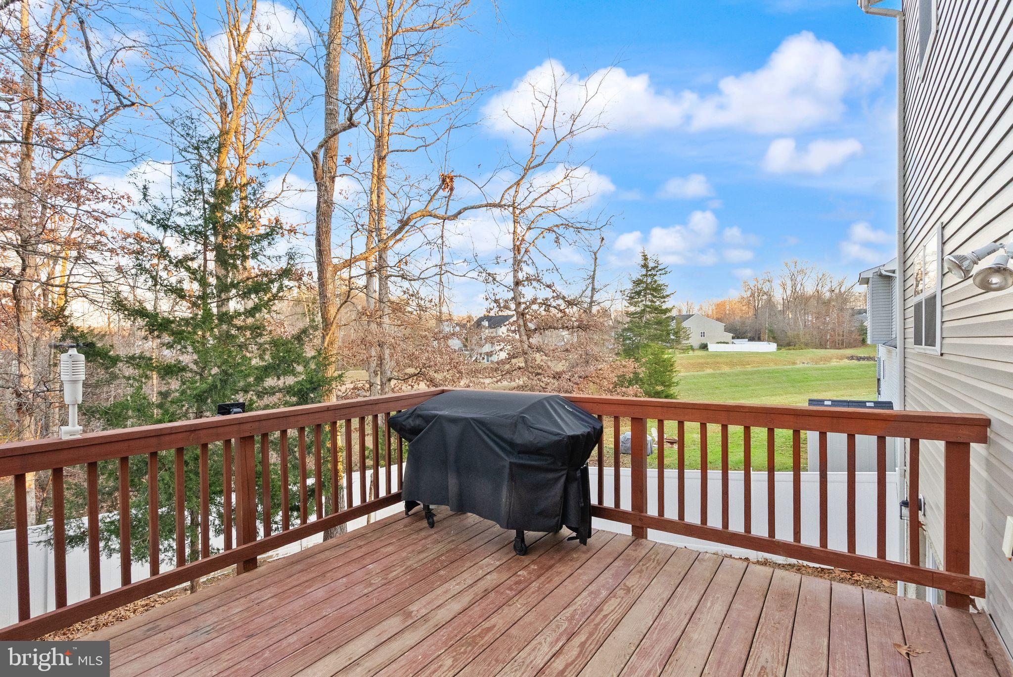 2219 Wildflower Way Locust Grove, VA 22508 - Photo 42 of 49 a view of balcony with wooden floor and fence