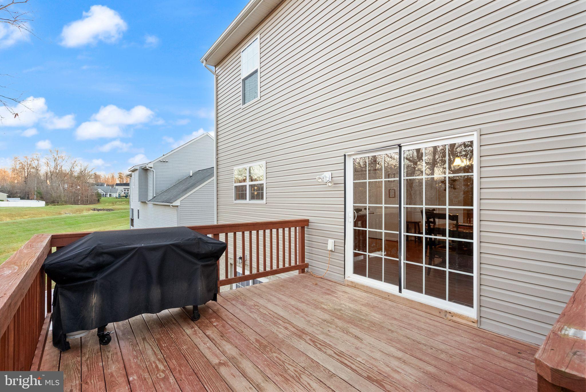 2219 Wildflower Way Locust Grove, VA 22508 - Photo 43 of 49 a view of a roof deck with couches and wooden floor
