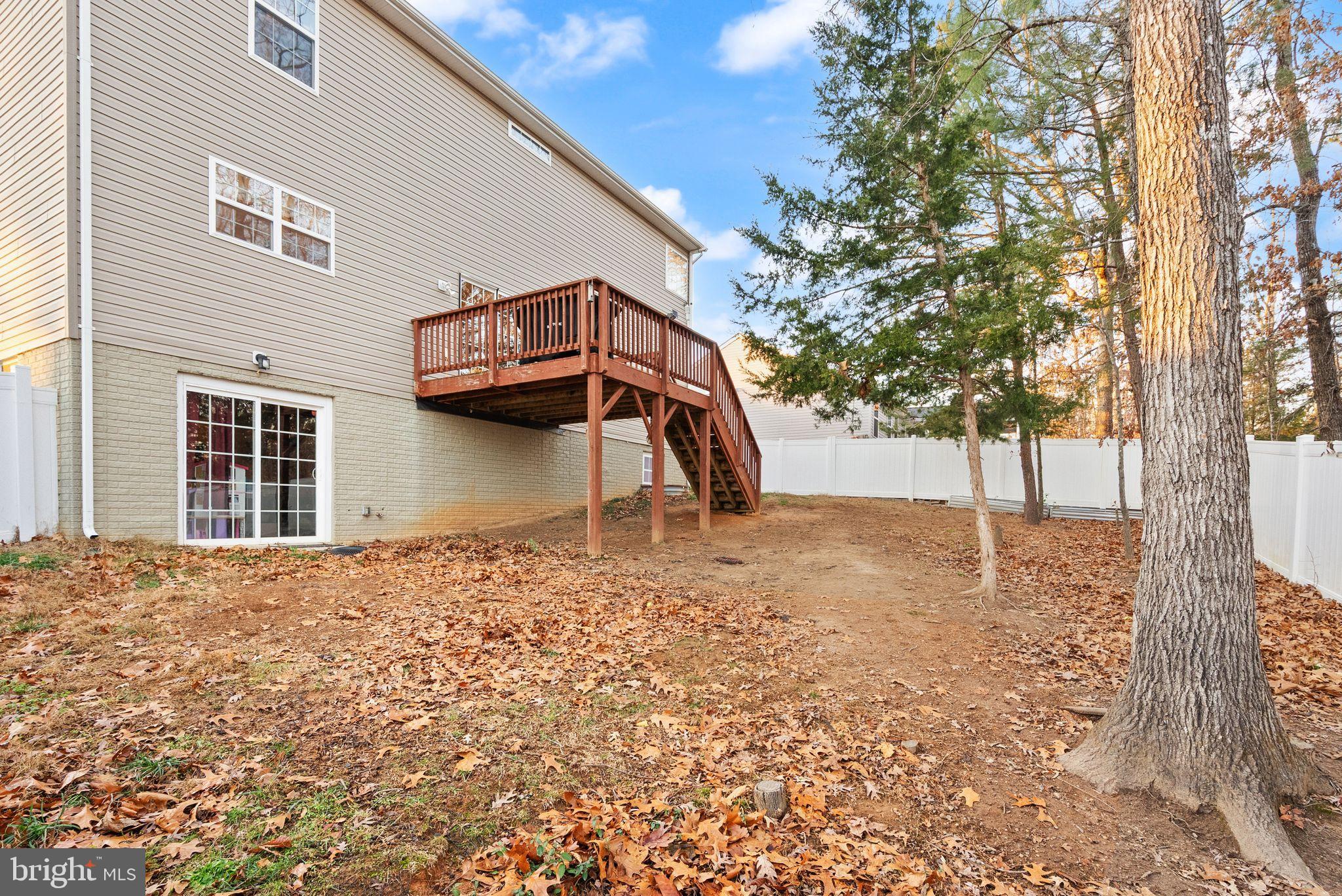 2219 Wildflower Way Locust Grove, VA 22508 - Photo 48 of 49 a backyard of a house with lots of green space