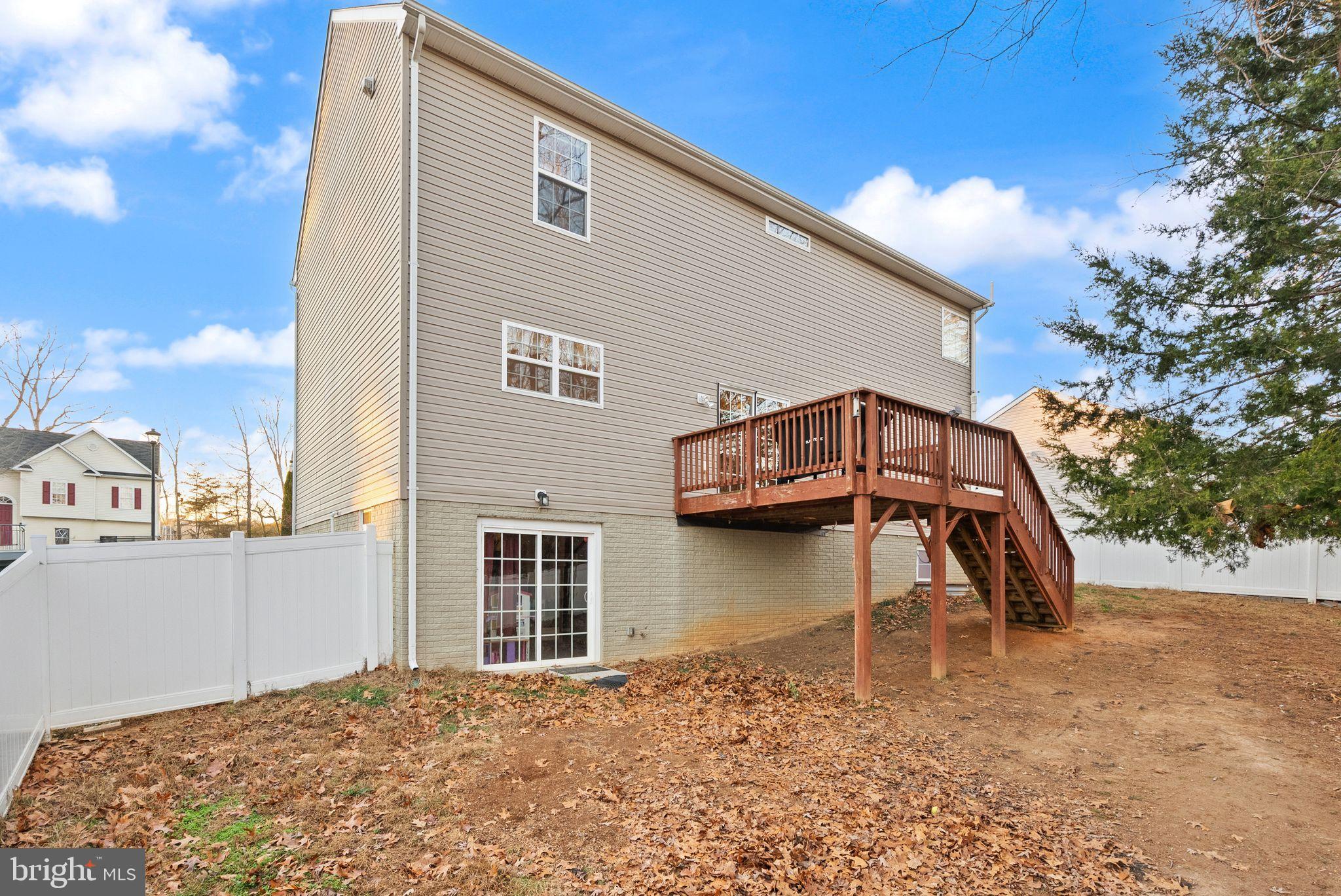 2219 Wildflower Way Locust Grove, VA 22508 - Photo 49 of 49 a view of a house with a yard