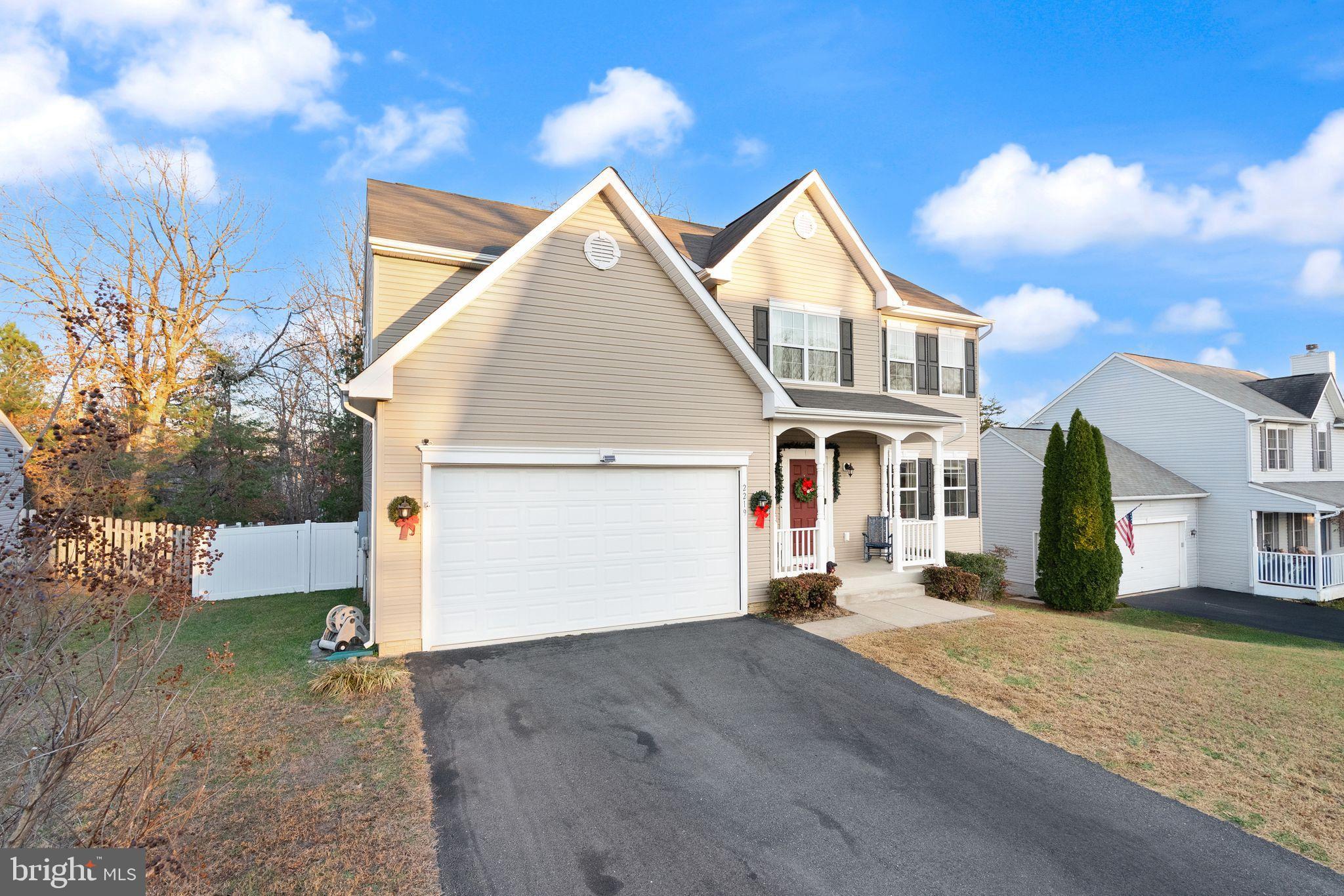 2219 Wildflower Way Locust Grove, VA 22508 - Photo 5 of 49 a front view of a house with a yard