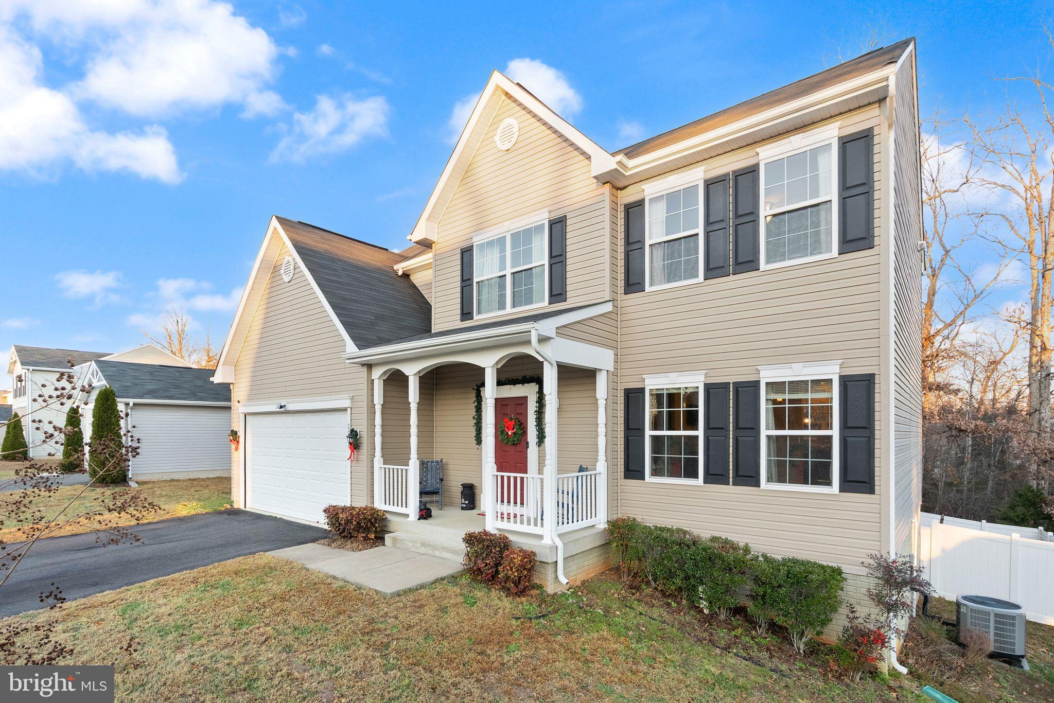 2219 Wildflower Way Locust Grove, VA 22508 - Photo 6 of 49 a front view of a house with garden