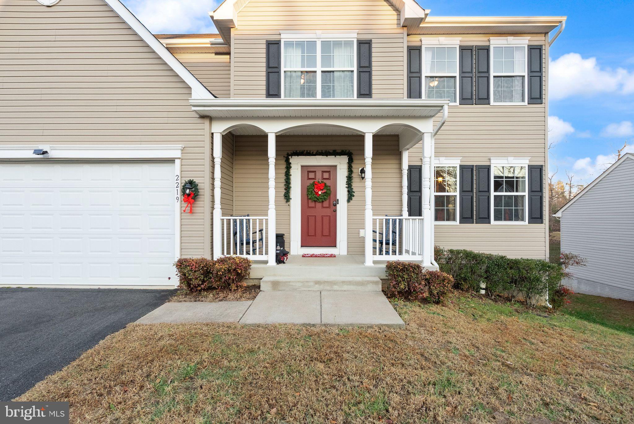 2219 Wildflower Way Locust Grove, VA 22508 - Photo 7 of 49 a front view of a house with yard