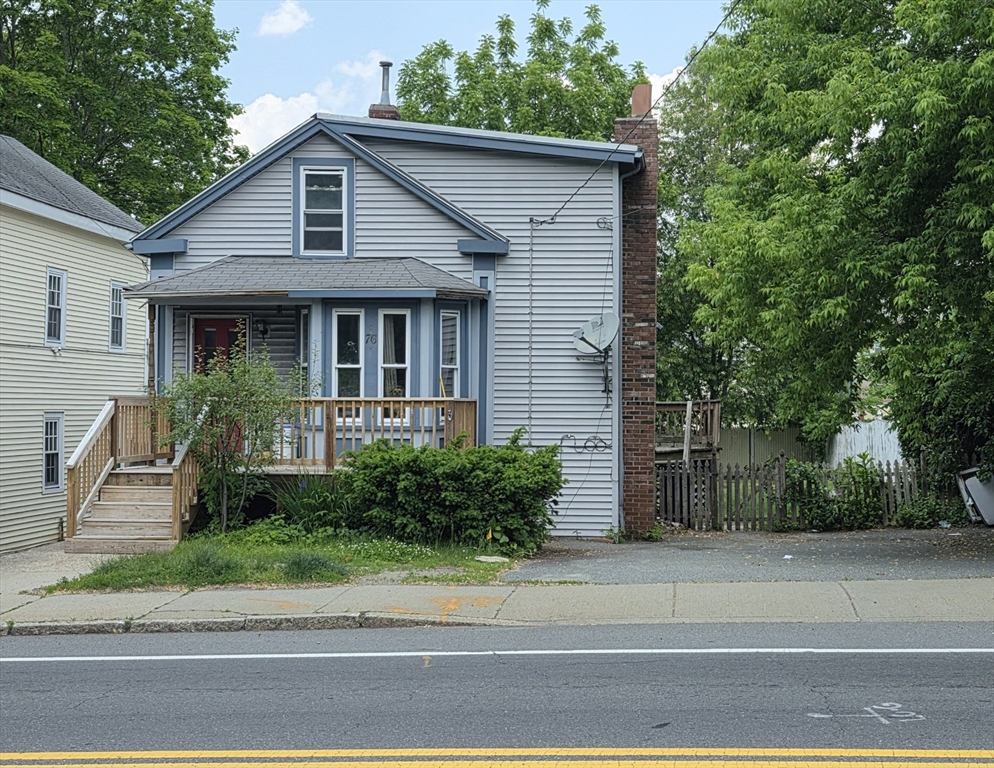 76 Main Street Blackstone, MA 01504 - Photo 1 of 1 a front view of a house with a garden