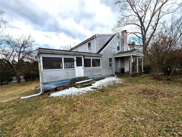 a house with trees in the background