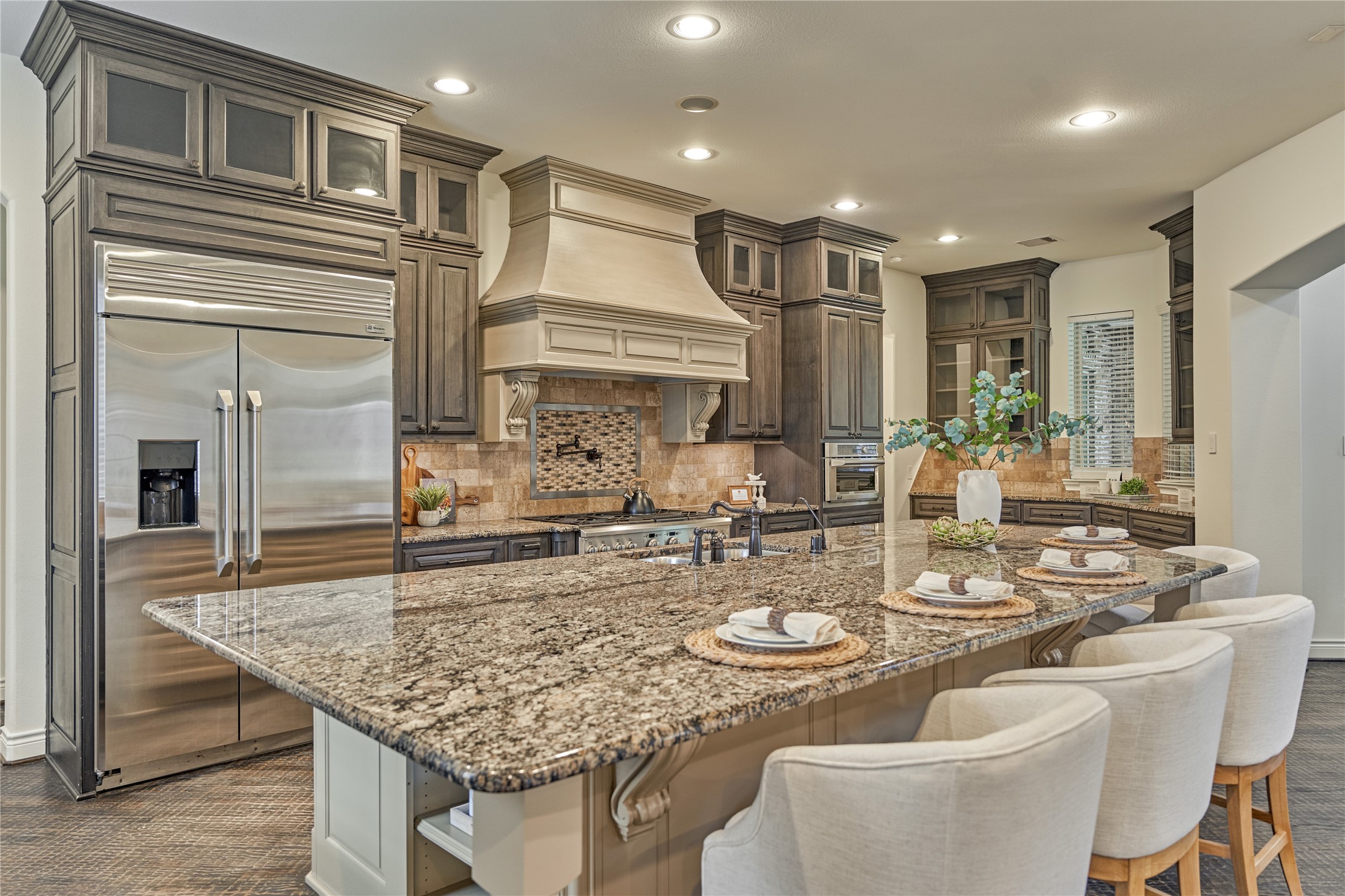 108 Evergreen Oak Drive Conroe, TX 77384 - Photo 14 of 45 Breakfast bar wraps this huge island