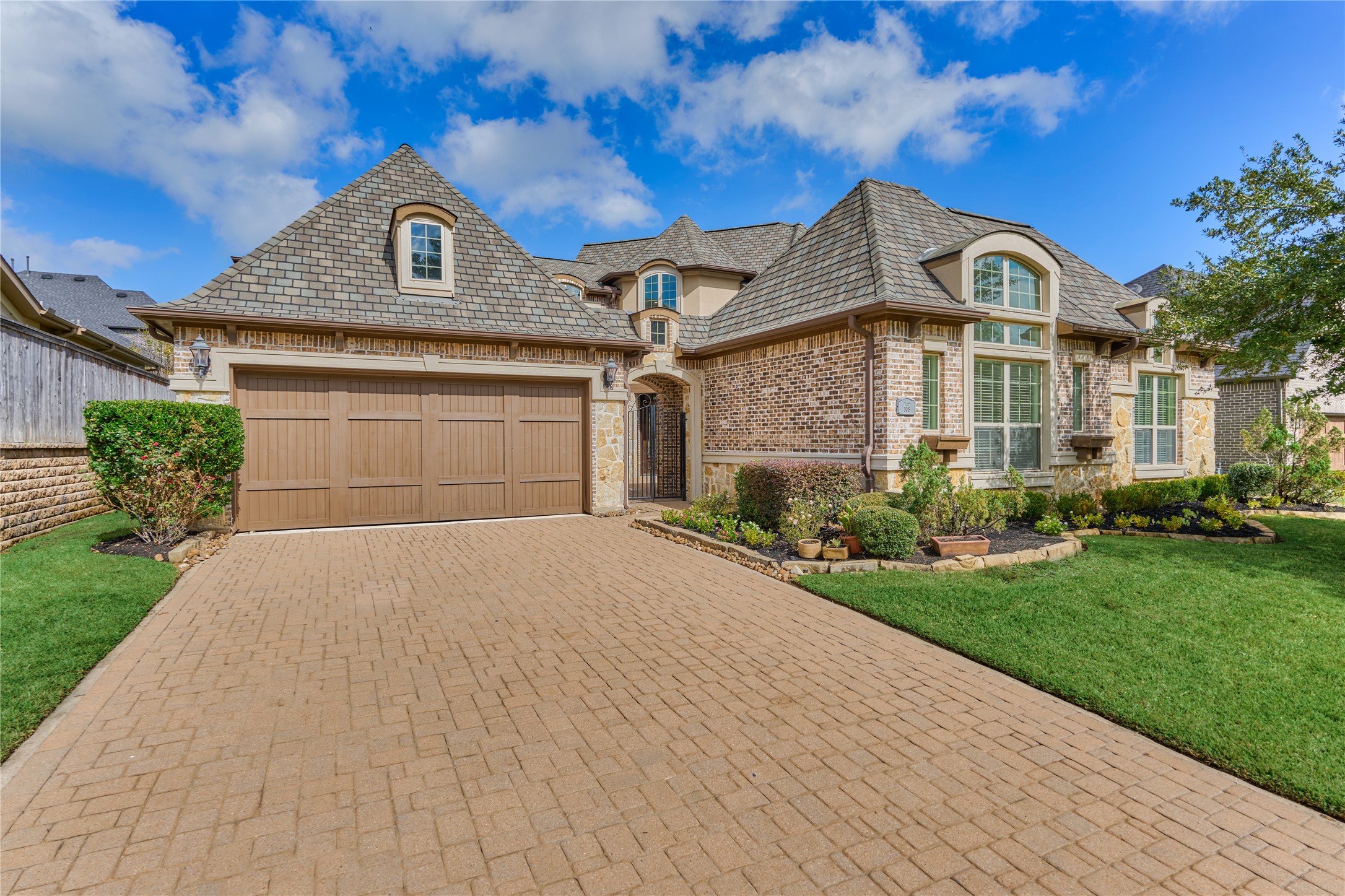 108 Evergreen Oak Drive Conroe, TX 77384 - Photo 2 of 45 Double wide paved driveway leads into a 3 car tandem garage. 3rd bay has Aircon