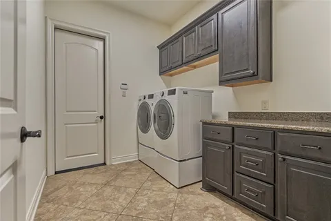 a utility room with cabinets