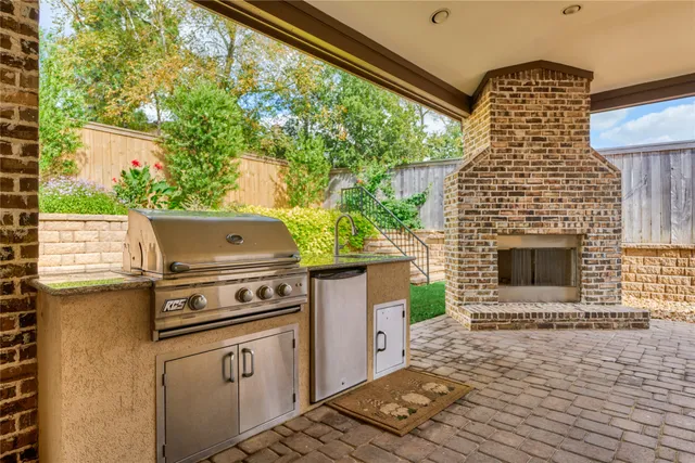 a stove top oven sitting next to a yard
