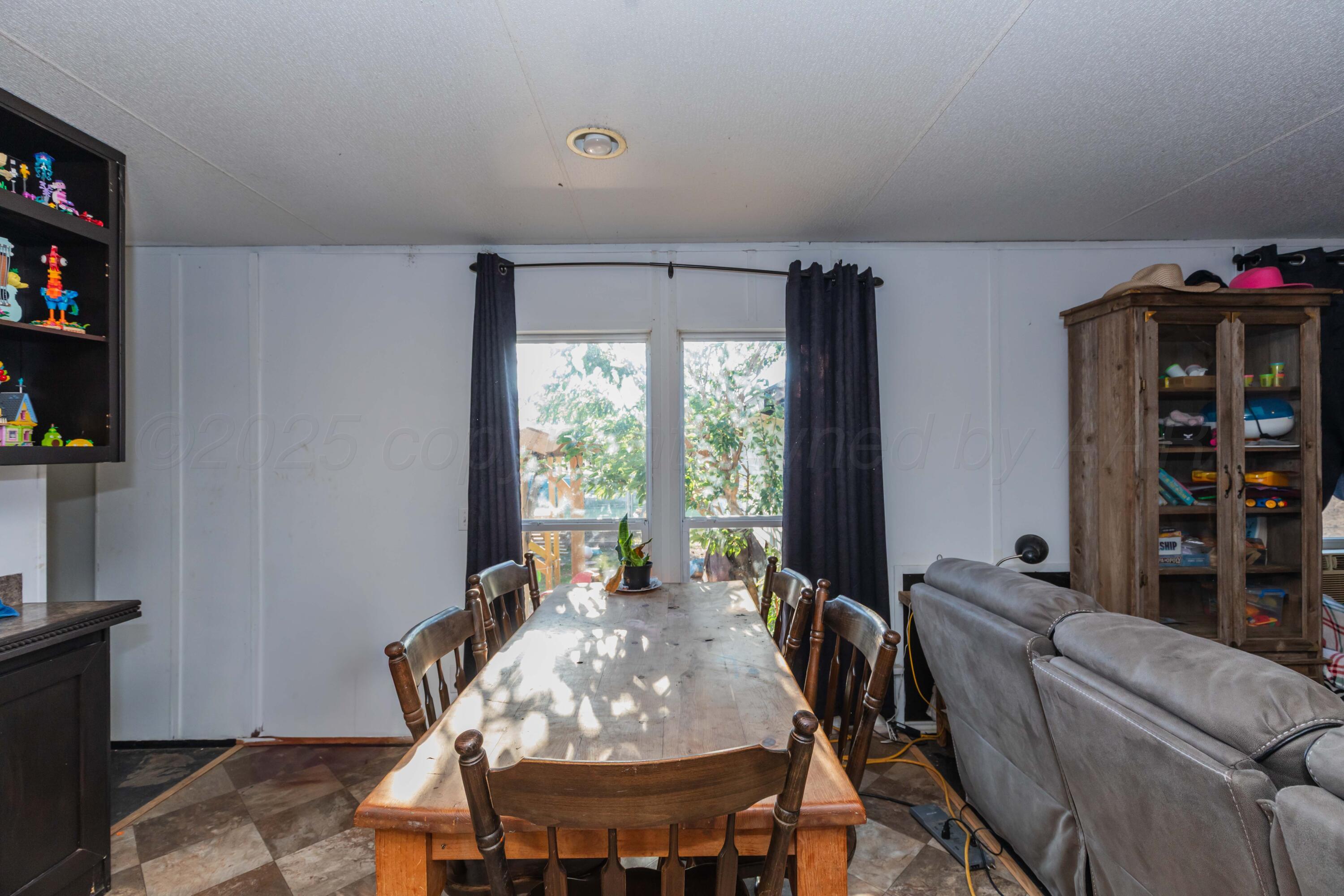 11566 County Road East Pampa, TX 79065 - Photo 12 of 56 a living room with furniture and a window