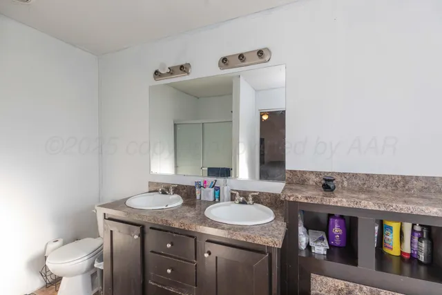 a bathroom with a granite countertop sink and a bathtub
