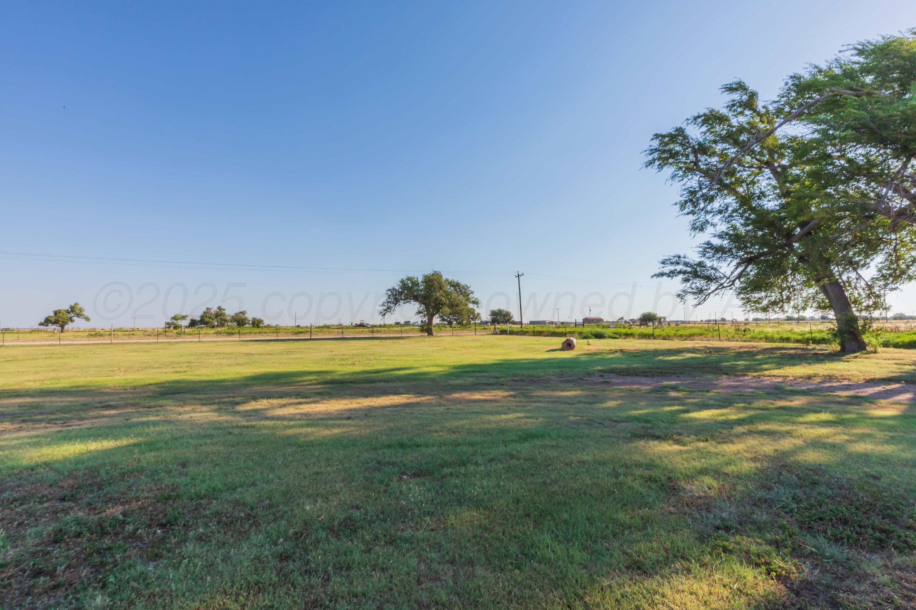 11566 County Road East Pampa, TX 79065 - Photo 34 of 56 a view of a swimming pool and an outdoor space