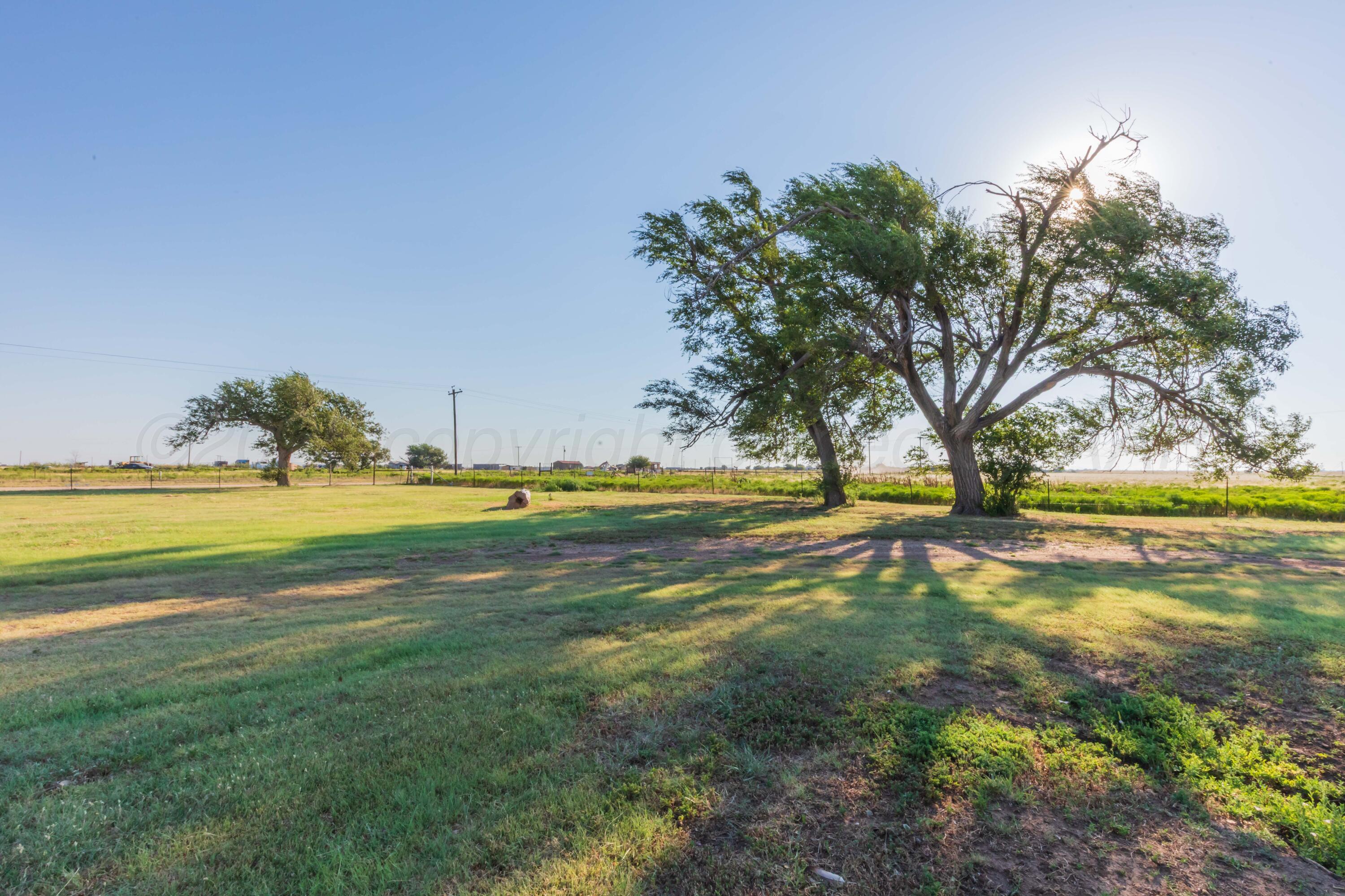 11566 County Road East Pampa, TX 79065 - Photo 35 of 56 a view of yard with swimming pool and green space