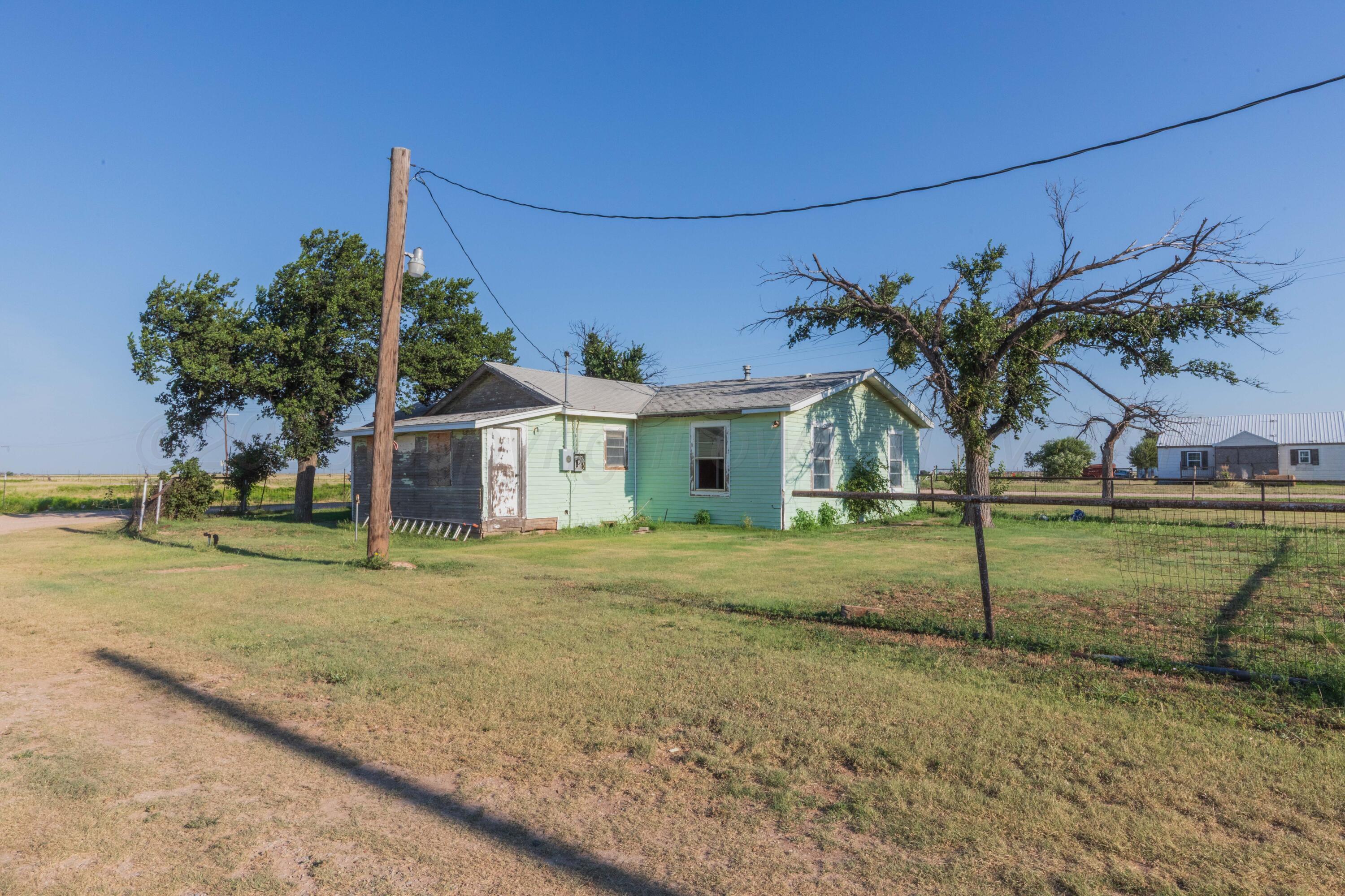 11566 County Road East Pampa, TX 79065 - Photo 37 of 56 a view of a house with a backyard