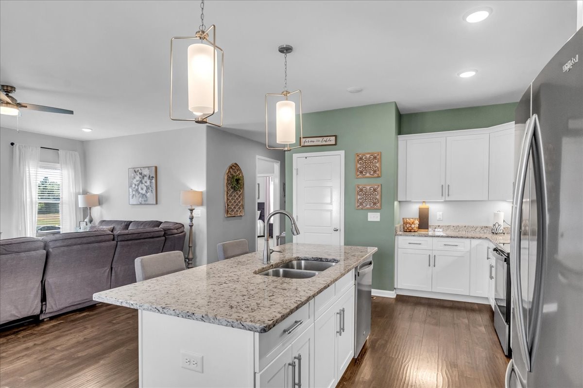 124 Cordell Love Road Smithville, TN 37166 - Photo 17 of 58 a kitchen with a center island appliances and cabinets