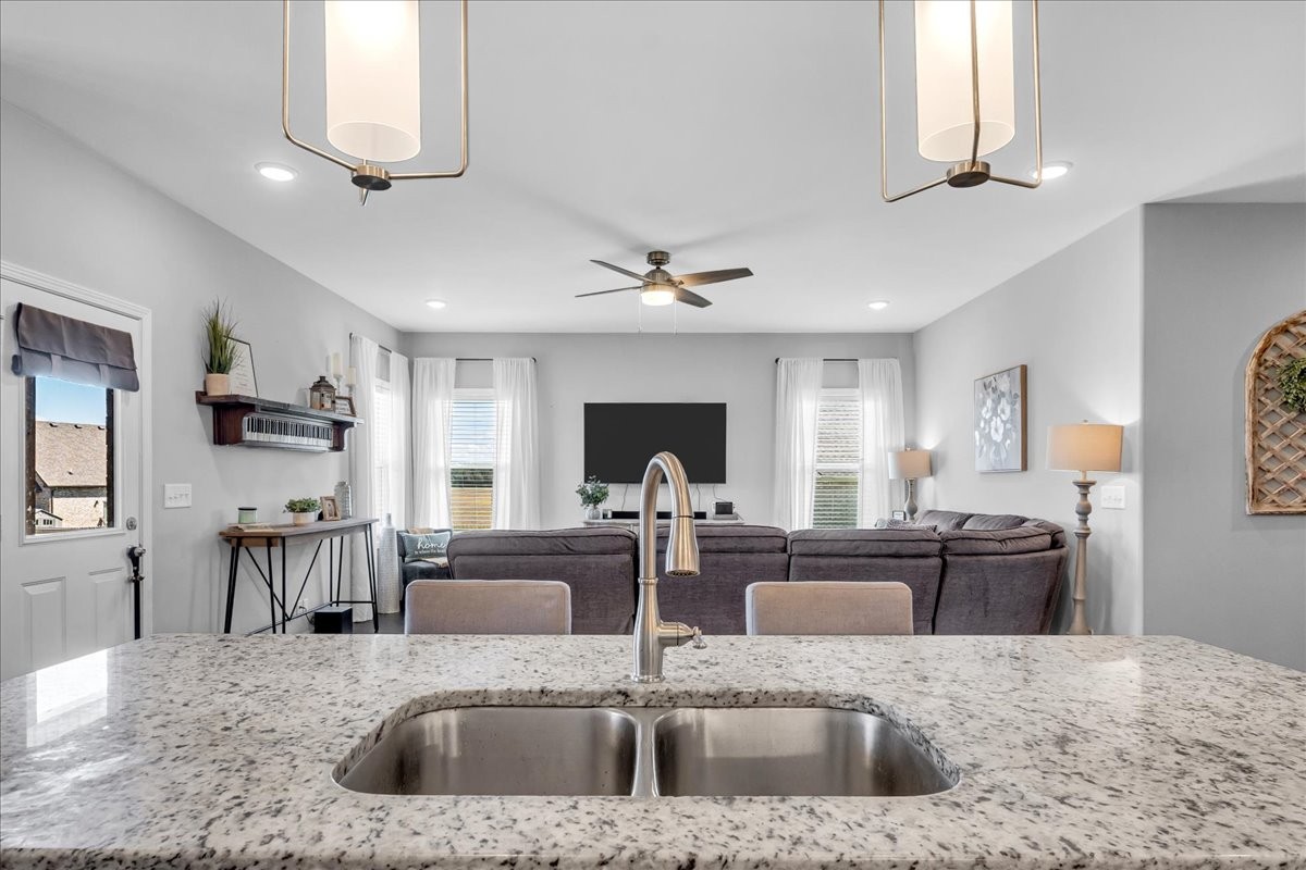124 Cordell Love Road Smithville, TN 37166 - Photo 21 of 58 a kitchen with a stove a sink and a refrigerator