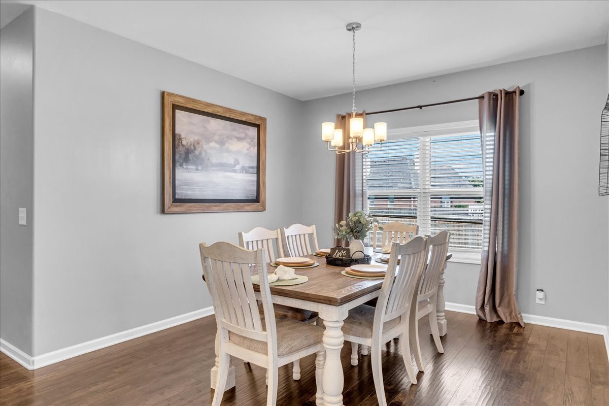 124 Cordell Love Road Smithville, TN 37166 - Photo 23 of 58 a view of a dining room with furniture window and wooden floor