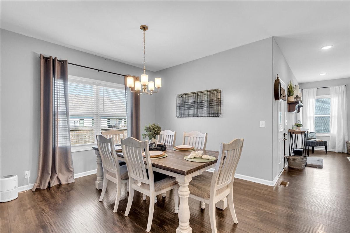 124 Cordell Love Road Smithville, TN 37166 - Photo 25 of 58 a view of a dining room with furniture window and wooden floor