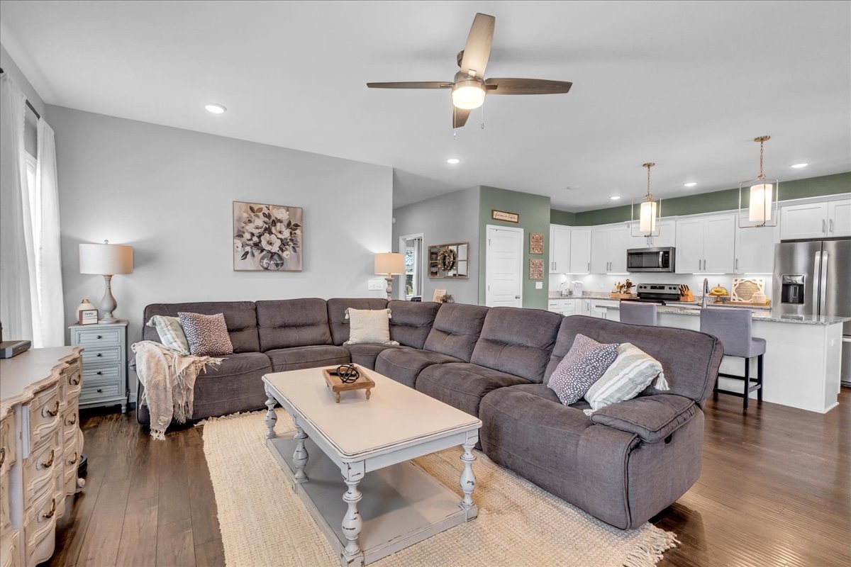 124 Cordell Love Road Smithville, TN 37166 - Photo 30 of 58 a living room with furniture kitchen view and a chandelier