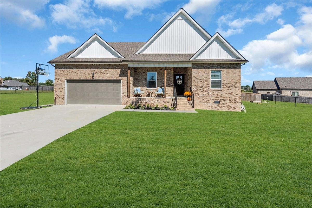 124 Cordell Love Road Smithville, TN 37166 - Photo 3 of 58 a front view of a house with garden and porch