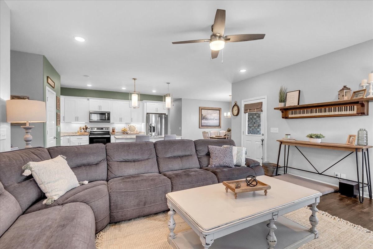 124 Cordell Love Road Smithville, TN 37166 - Photo 31 of 58 a living room with furniture and kitchen view