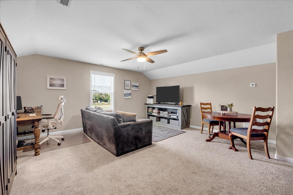 124 Cordell Love Road Smithville, TN 37166 - Photo 42 of 58 a living room with furniture and a flat screen tv