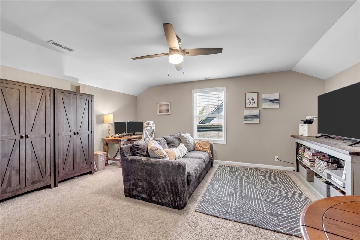 124 Cordell Love Road Smithville, TN 37166 - Photo 43 of 58 a living room with furniture and a flat screen tv