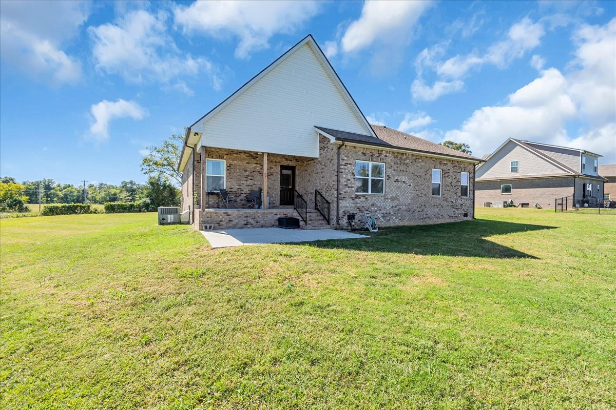 124 Cordell Love Road Smithville, TN 37166 - Photo 47 of 58 a view of a house with a big yard potted plants and large tree