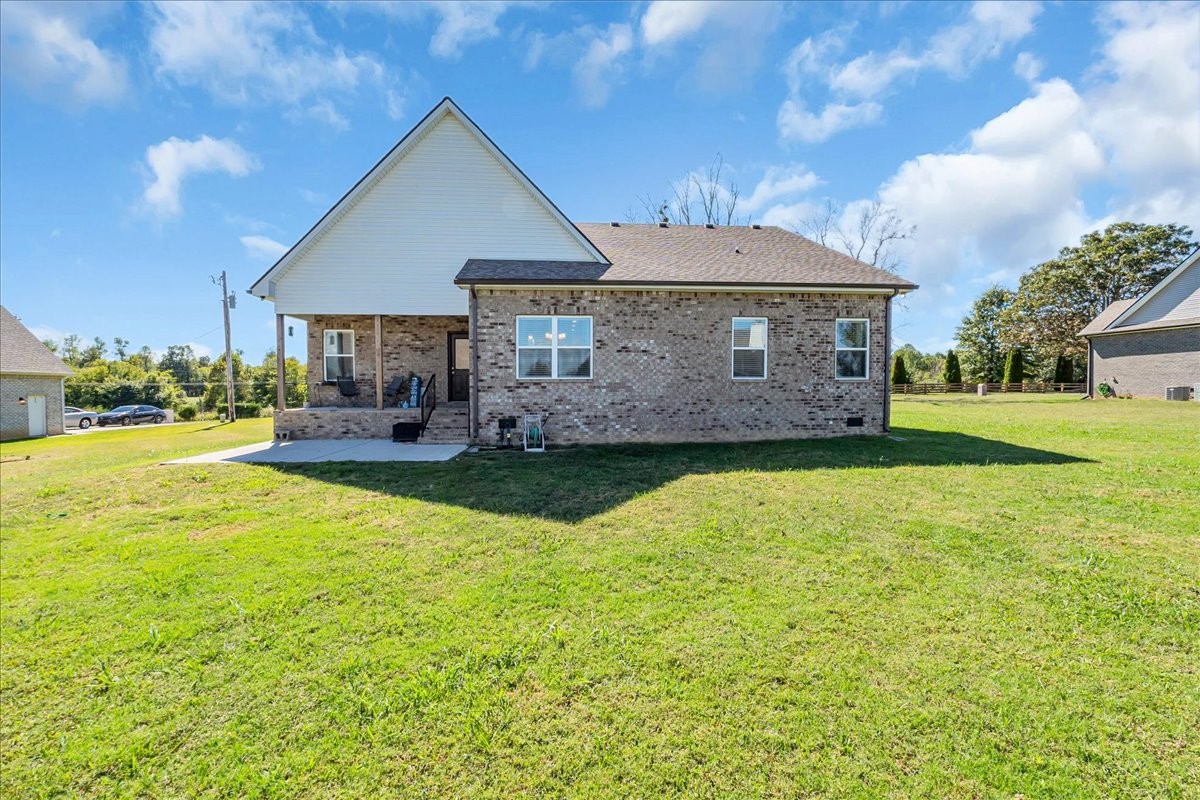 124 Cordell Love Road Smithville, TN 37166 - Photo 48 of 58 a front view of a house with garden