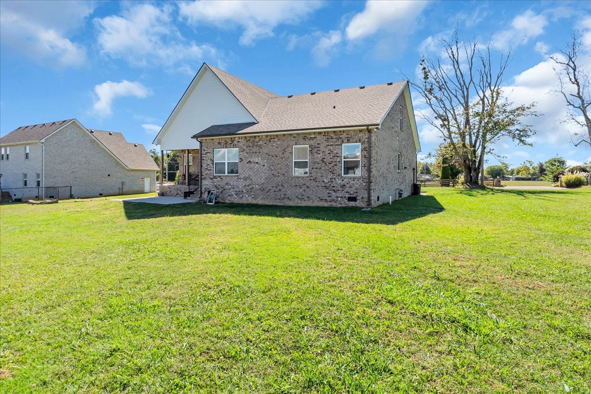 124 Cordell Love Road Smithville, TN 37166 - Photo 49 of 58 a view of a house with a big yard and a large tree