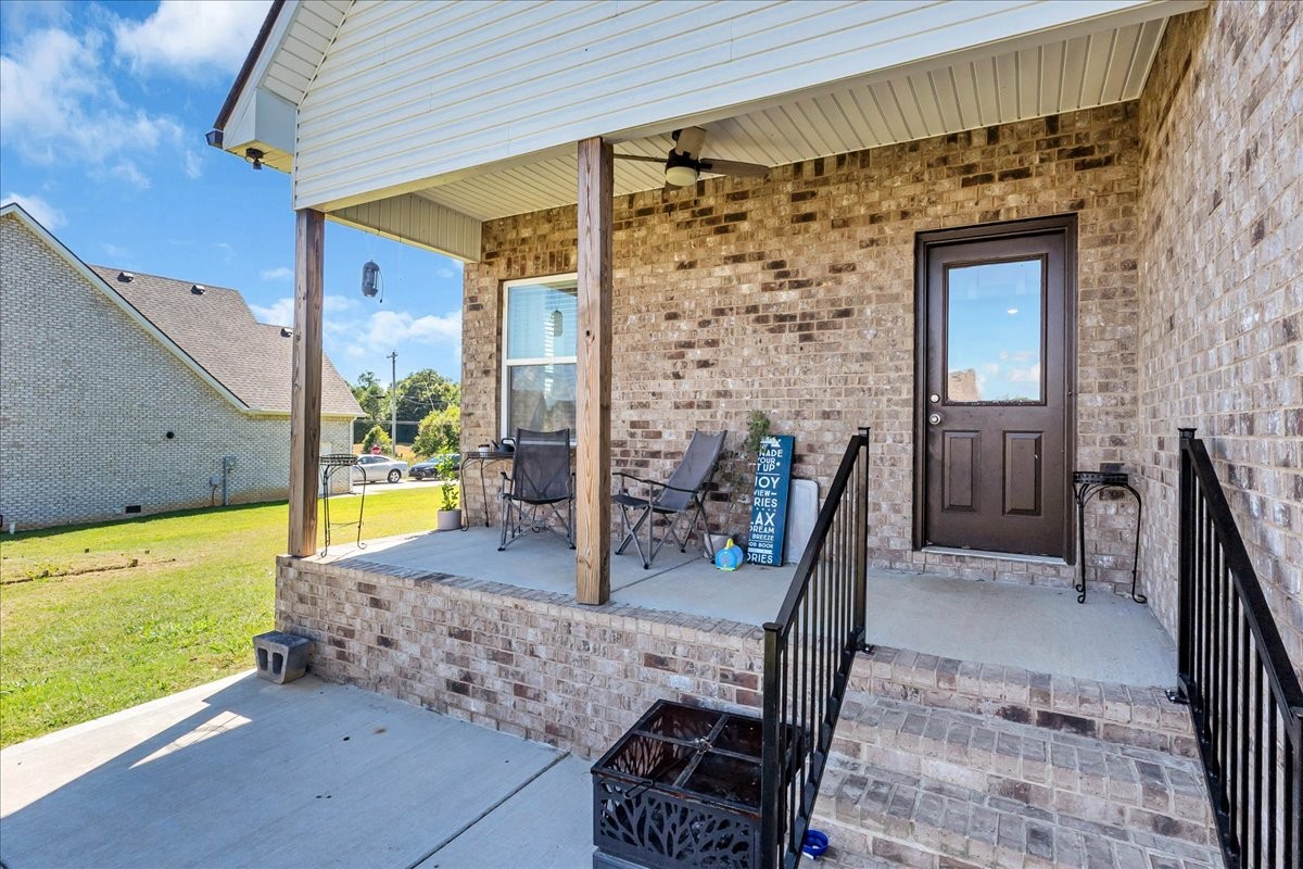 124 Cordell Love Road Smithville, TN 37166 - Photo 50 of 58 a view of a patio with table and chairs and potted plants
