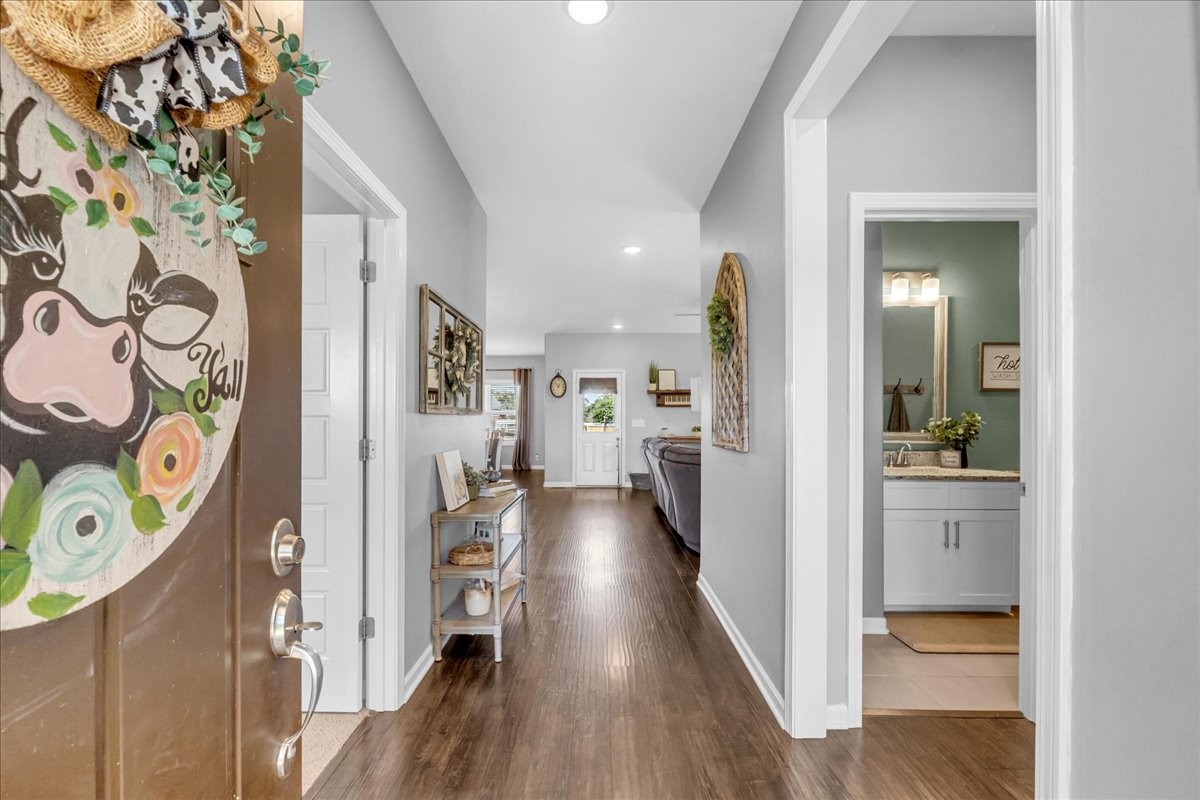 124 Cordell Love Road Smithville, TN 37166 - Photo 5 of 58 a view of a hallway view with living room and wooden floor