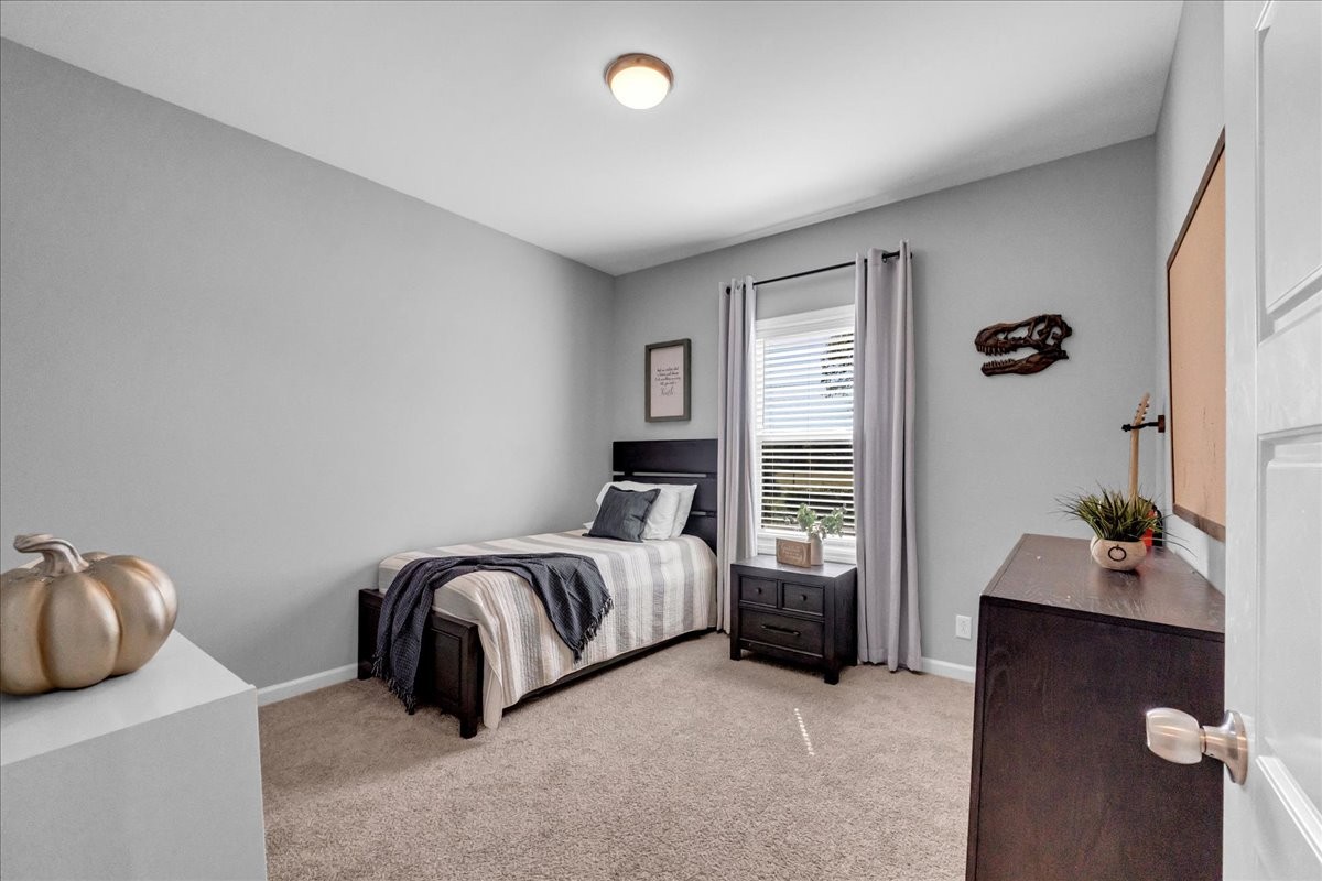 124 Cordell Love Road Smithville, TN 37166 - Photo 9 of 58 a bed room with a bed and a window