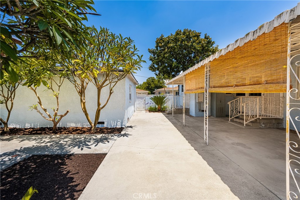 2229 Cowlin Avenue Commerce, CA 90040 - Photo 28 of 34 a front view of a house with a yard