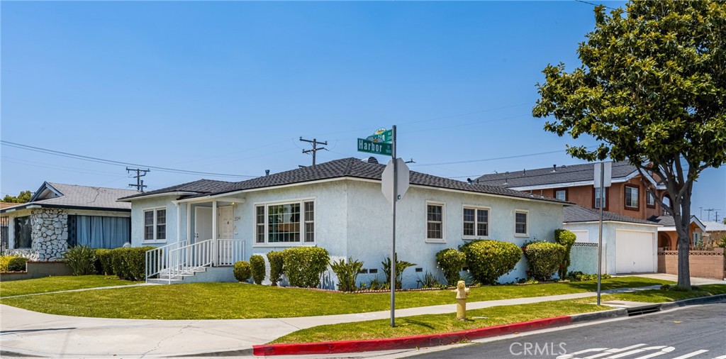 2229 Cowlin Avenue Commerce, CA 90040 - Photo 3 of 34 a front view of a house with a yard