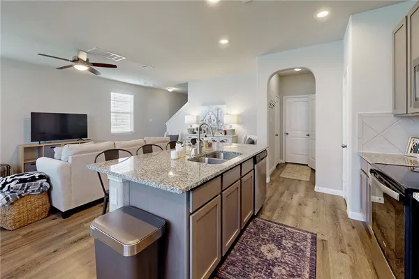 a spacious bathroom with a granite countertop tub sink and a mirror
