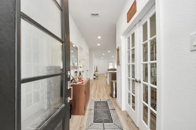 a view of a living room with a floor to ceiling window