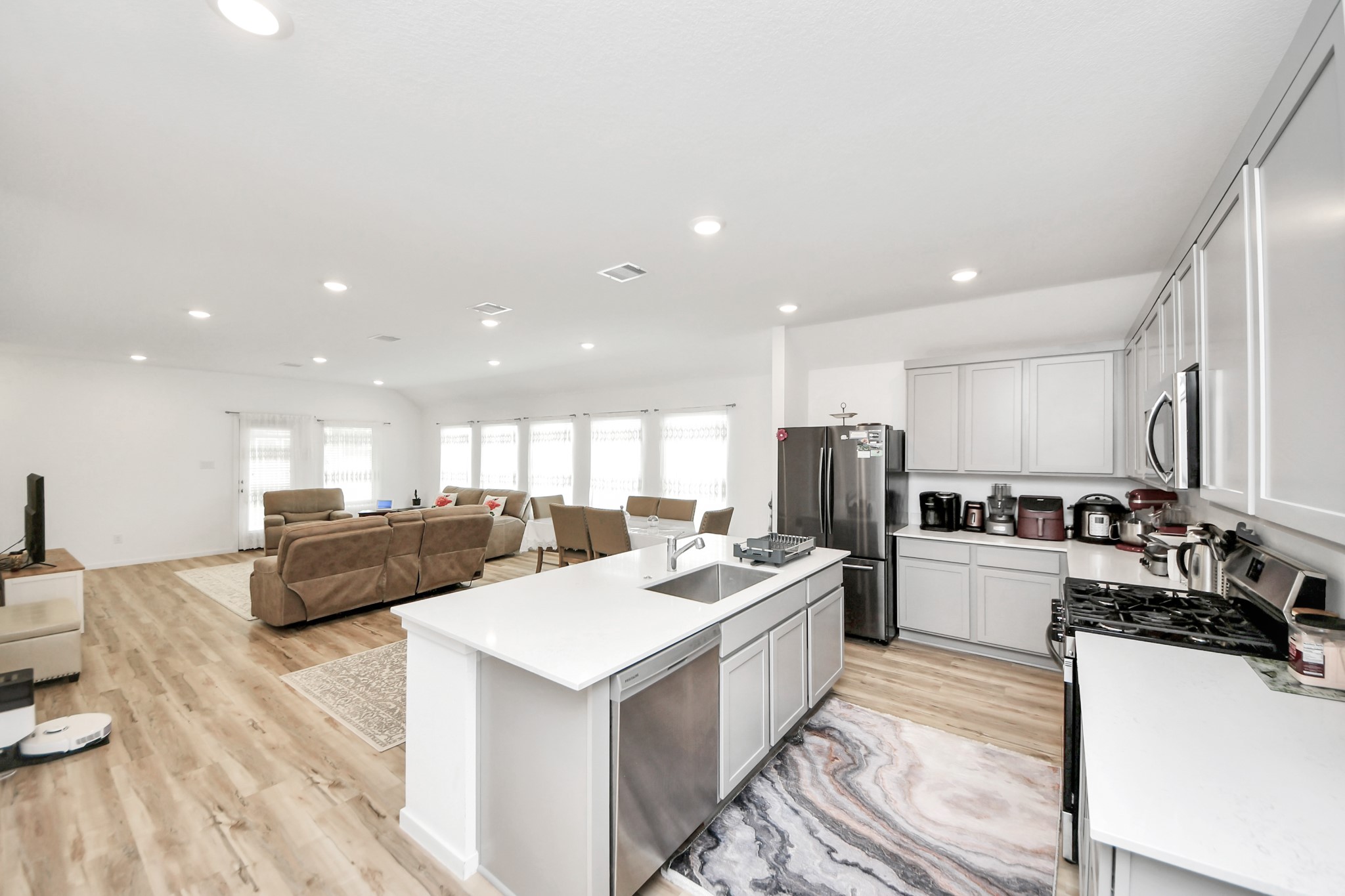 21927 Citrus Grove Cypress, TX 77433 - Photo 12 of 42 a kitchen with refrigerator a stove a oven a sink counter top space and furniture