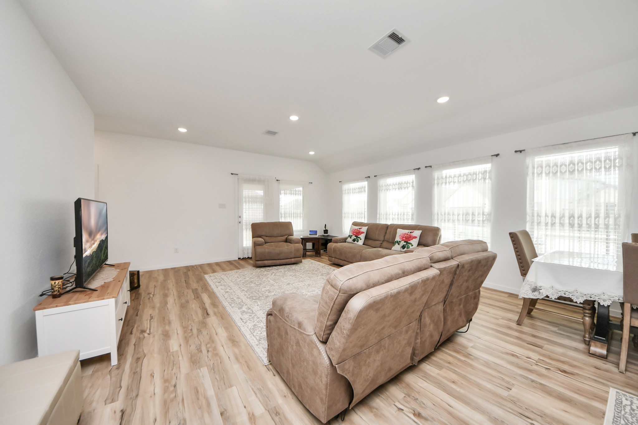 21927 Citrus Grove Cypress, TX 77433 - Photo 20 of 42 a large bedroom with a bed and large windows