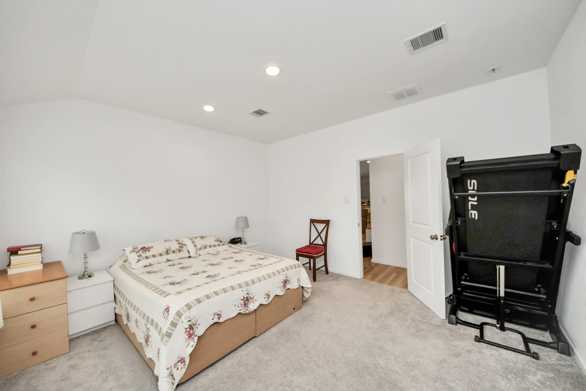 21927 Citrus Grove Cypress, TX 77433 - Photo 27 of 42 a bedroom that has a bed and a chair in it