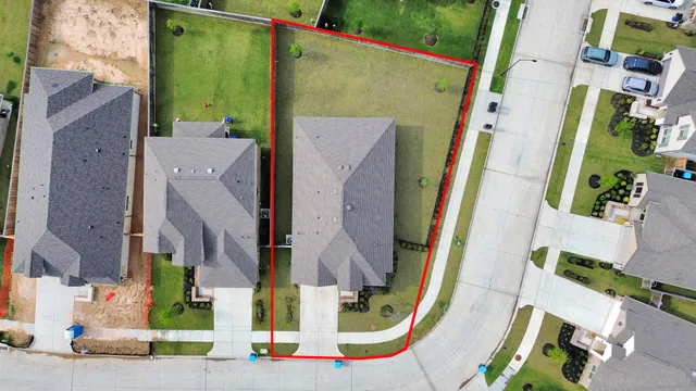 an aerial view of residential house with outdoor space and swimming pool