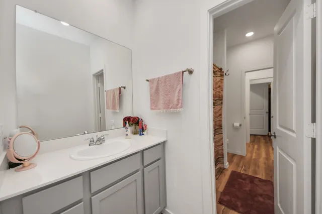 a bathroom with a sink double vanity and a mirror