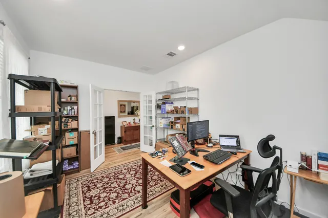a workspace with furniture and bookshelf