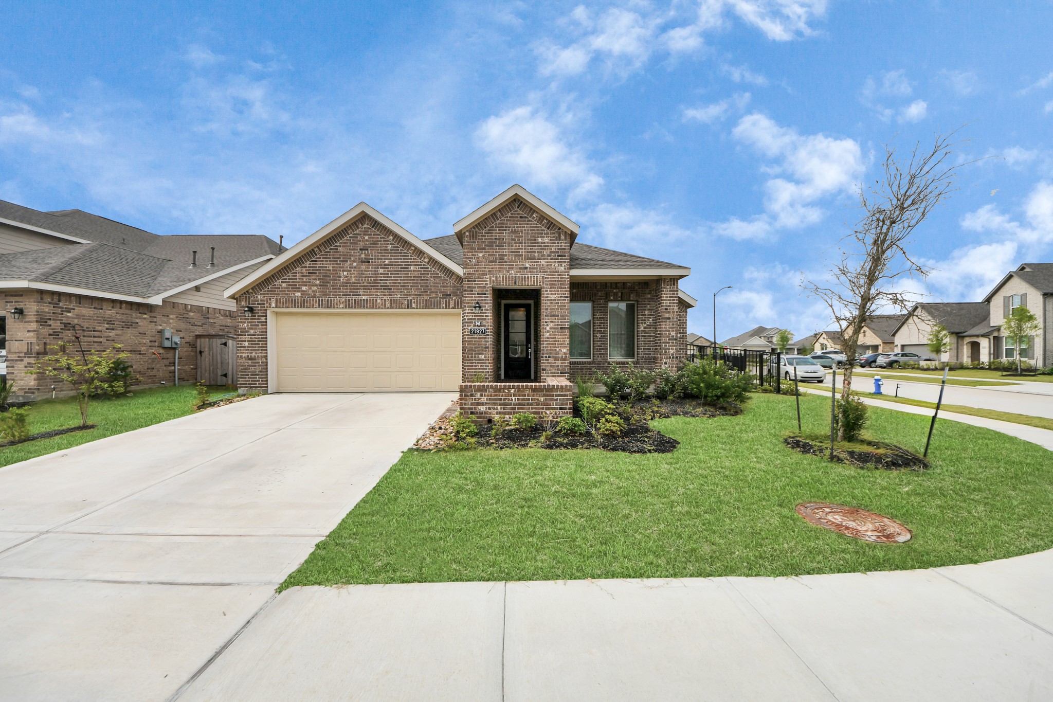 21927 Citrus Grove Cypress, TX 77433 - Photo 5 of 42 a front view of a house with garden