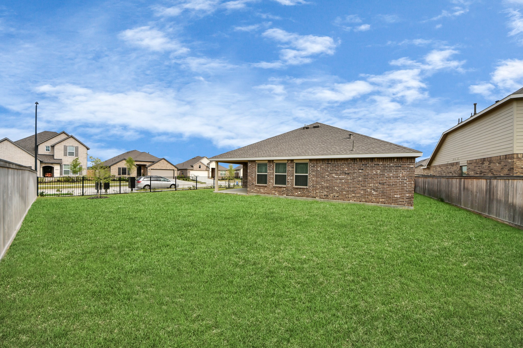 21927 Citrus Grove Cypress, TX 77433 - Photo 9 of 42 a view of an house with backyard space and garden