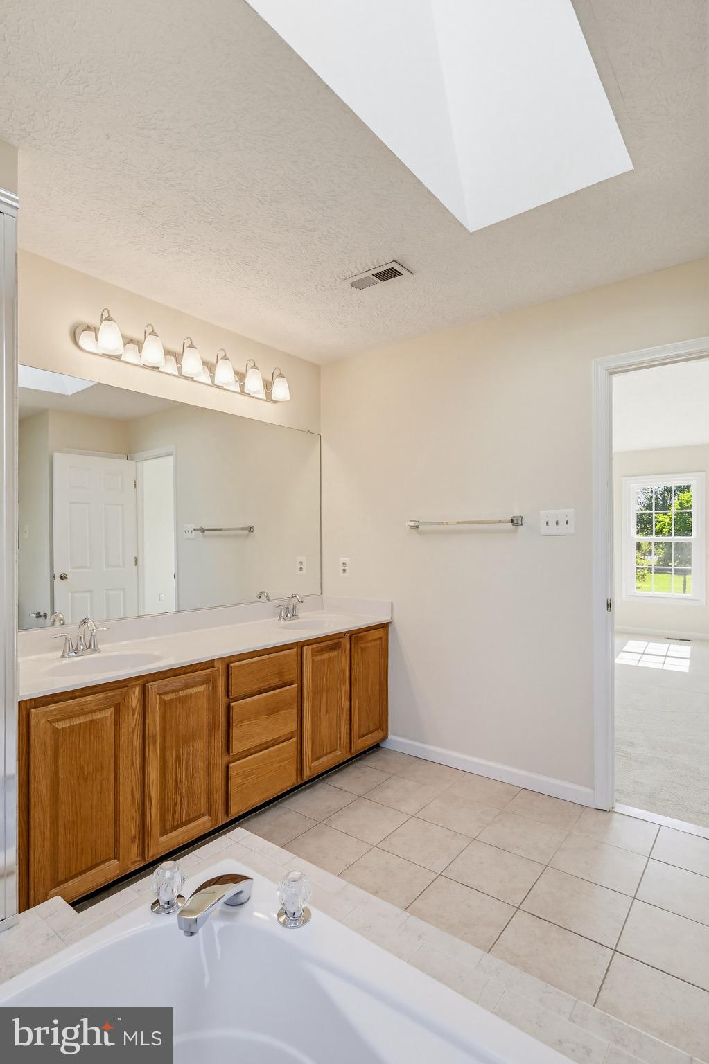 8266 Spring Branch Court Laurel, MD 20723 - Photo 37 of 73 Primary bathroom - skylight & windows!